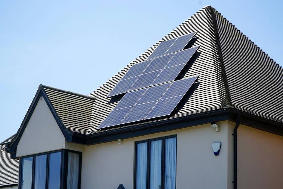 Close-up of high-efficiency solar panel connectors installed on rooftop panels under bright sunlight