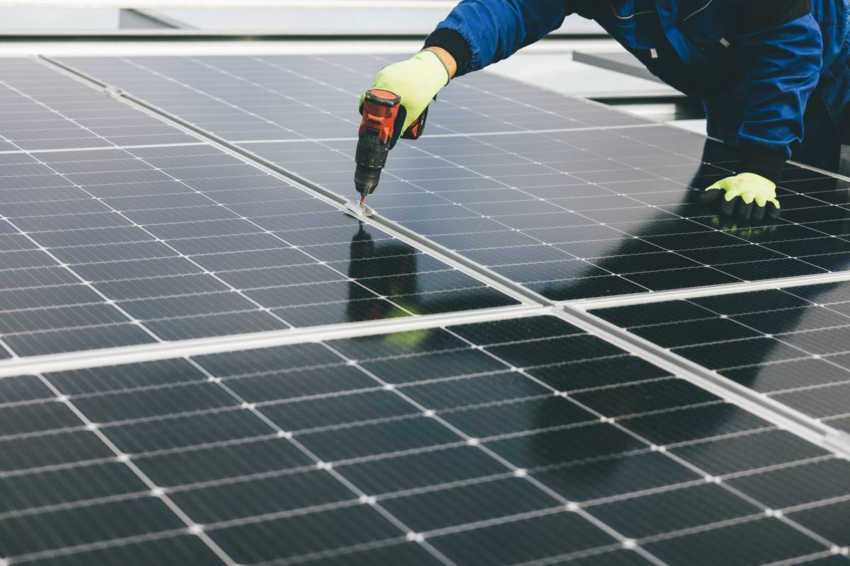Close-up of lion energy solar panel connectors showing secure locking tabs and IP68-rated housing on rooftop array