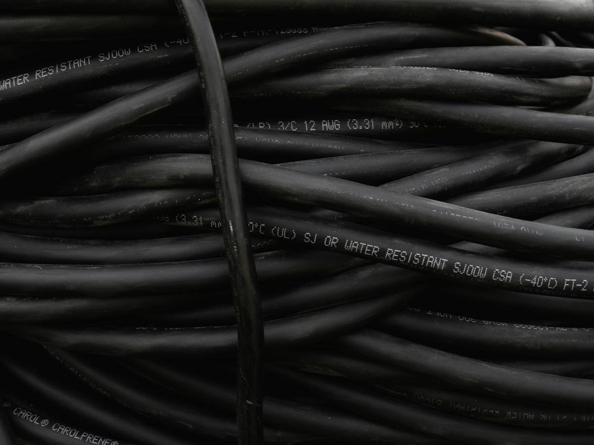 Close-up of properly installed solar panel cable connectors showing secure MC4 locking mechanism and weatherproof seal