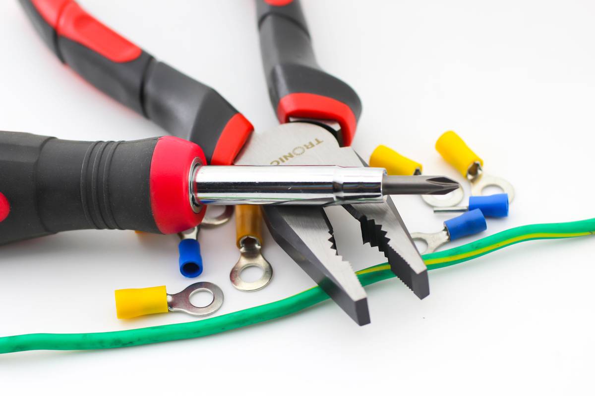 Close-up of MC4-style connectors for solar panel wires showing proper locking mechanism and insulation